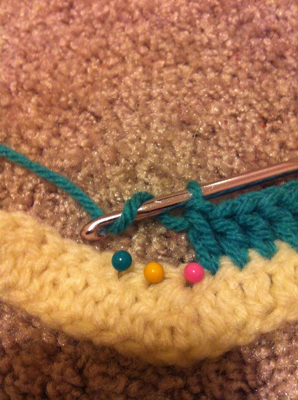 work the dc3tog into the next 3 stitches. the one befor the previous dc3tog (pink), the previous dc3tog (yellow) and the one after the previous dc3tog (green).