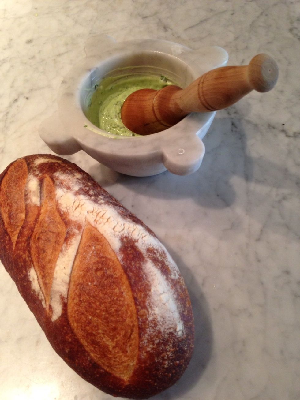 Work the ingredients together to combine and emulsify; the basil should color the mayonnaise a beautiful green color, and the clove of garlic should be completely broken down.