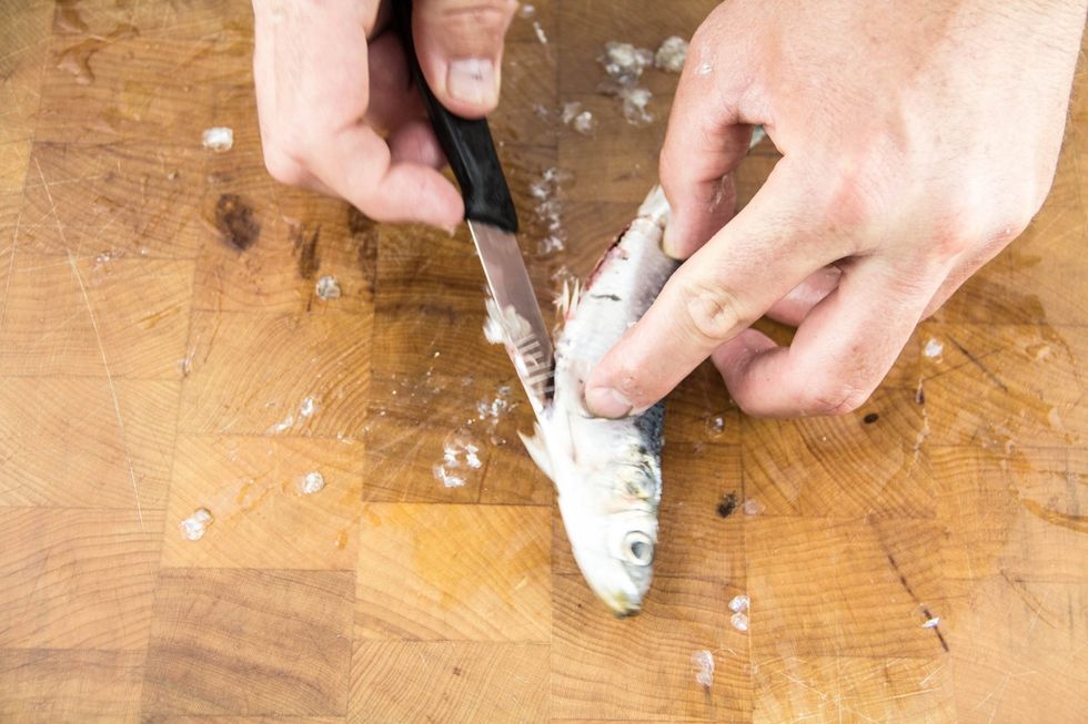 Work the knife up in one swift motion.