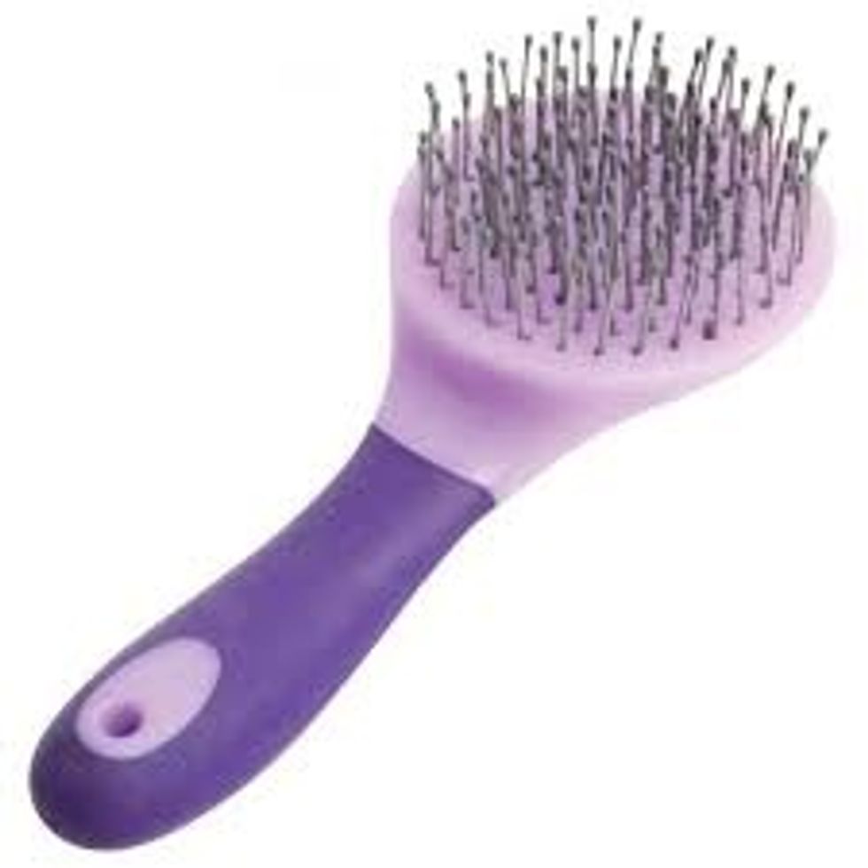 Work the mane comb through the horse's mane and tail. It's OK to pull hard (horses can't feel it), but do not jerk the comb. It isn't necessary to comb the mane and tail every time you groom a horse.