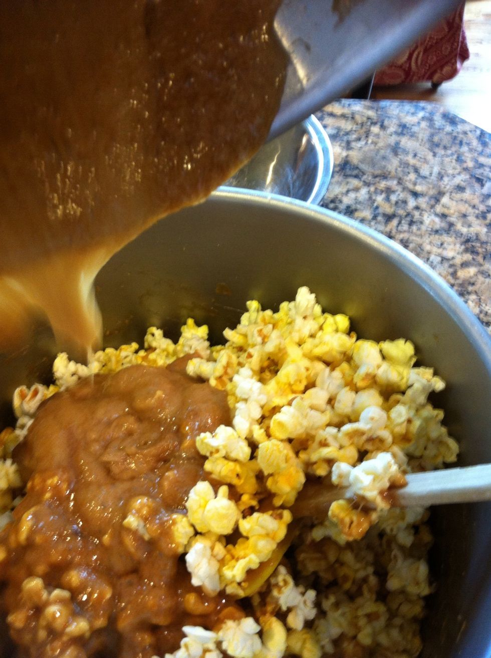 Working quickly, coat the first batch with half the caramel.