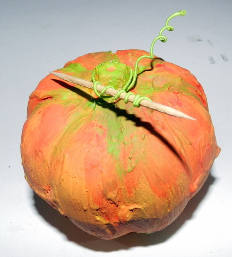 wrap a green wire with the help of a toothpick.