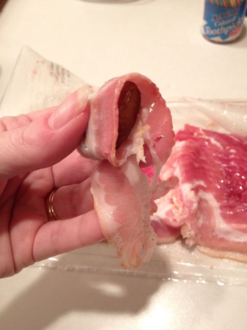 Wrap a half slice of bacon around chestnut.