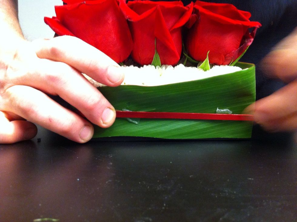 Wrap a piece of decorative flat wire around container - attach with UGLU.