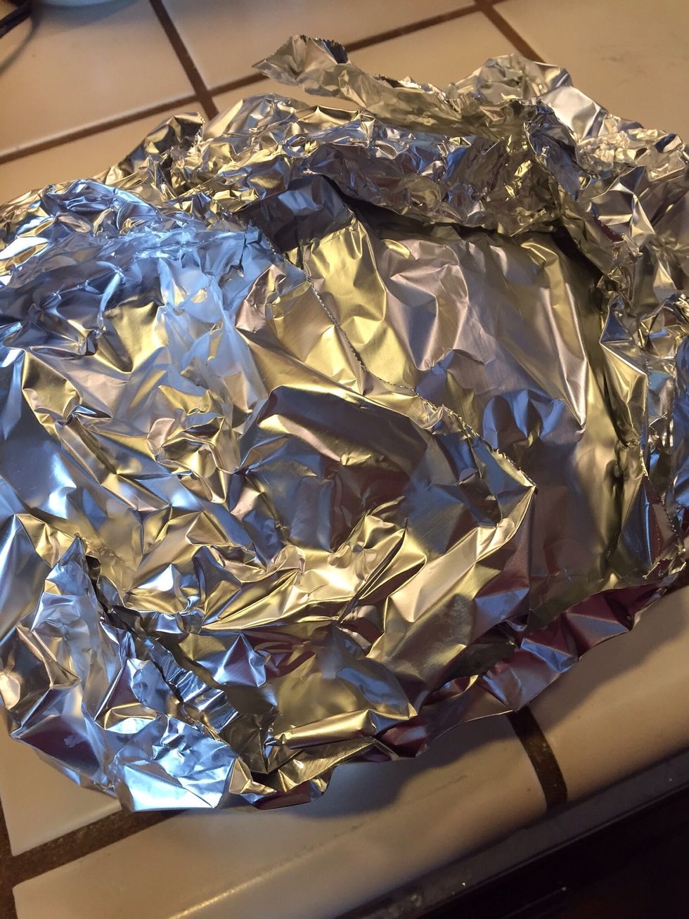 Wrap bread loosely in foil. Bake at 350 degrees for 15 minutes. Unwrap the bread and bake for another 10-15 minutes or until cheese melts.