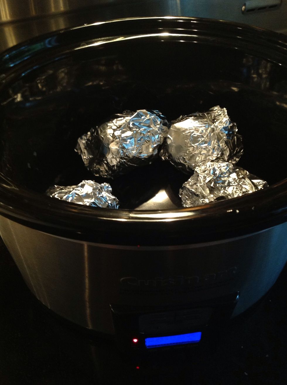 Wrap each beet in tinfoil. Place beets in slow cooker. Cook on high for 4-6 hours depending on the size of your beets, and how many you have.