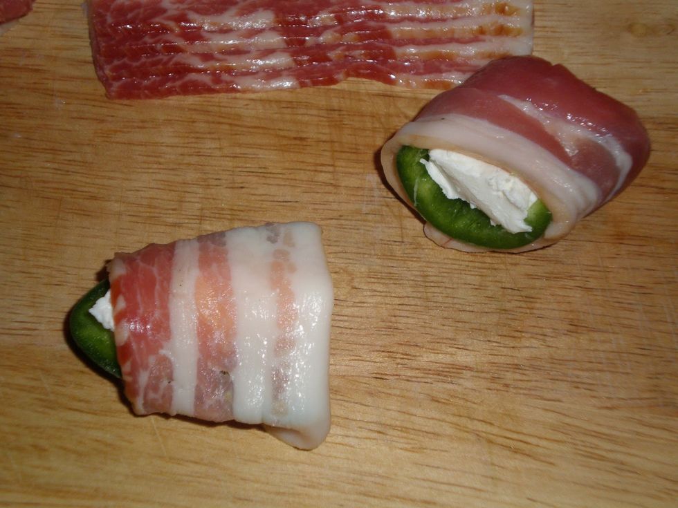 Wrap each piece with a slice of bacon.