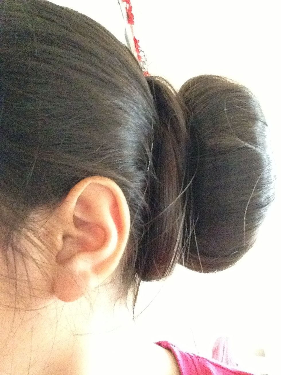 Wrap excess hair around bun and secure in place with bobby pins.