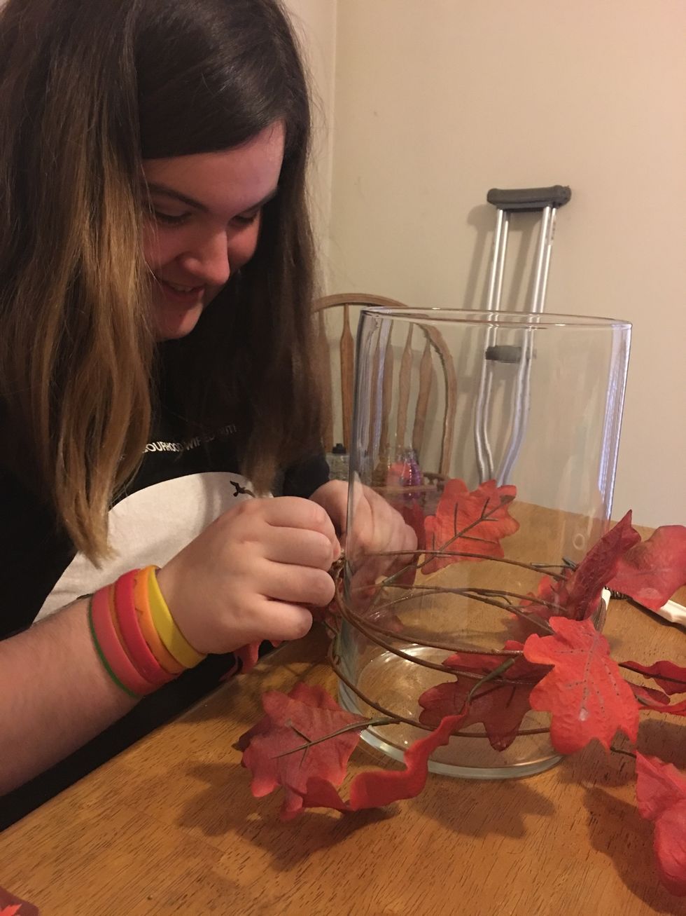 Wrap fall garland around case and tie it twice.