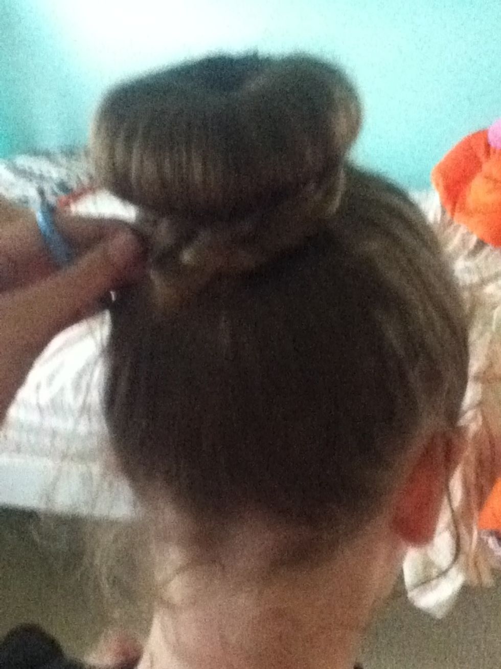 Wrap hair around bun with hair pins