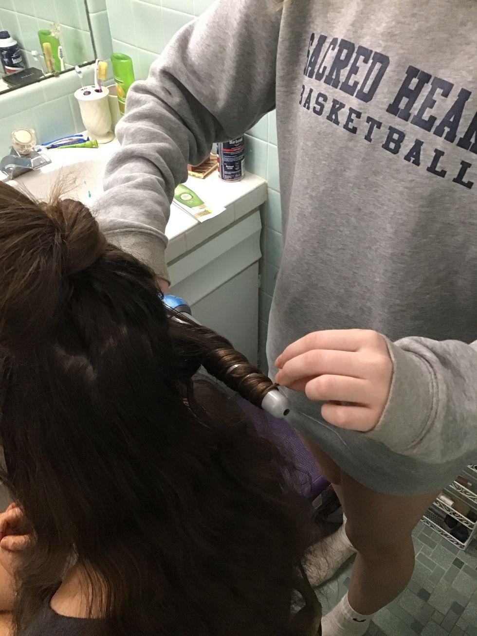 Wrap hair around wand, and do this to all the hair