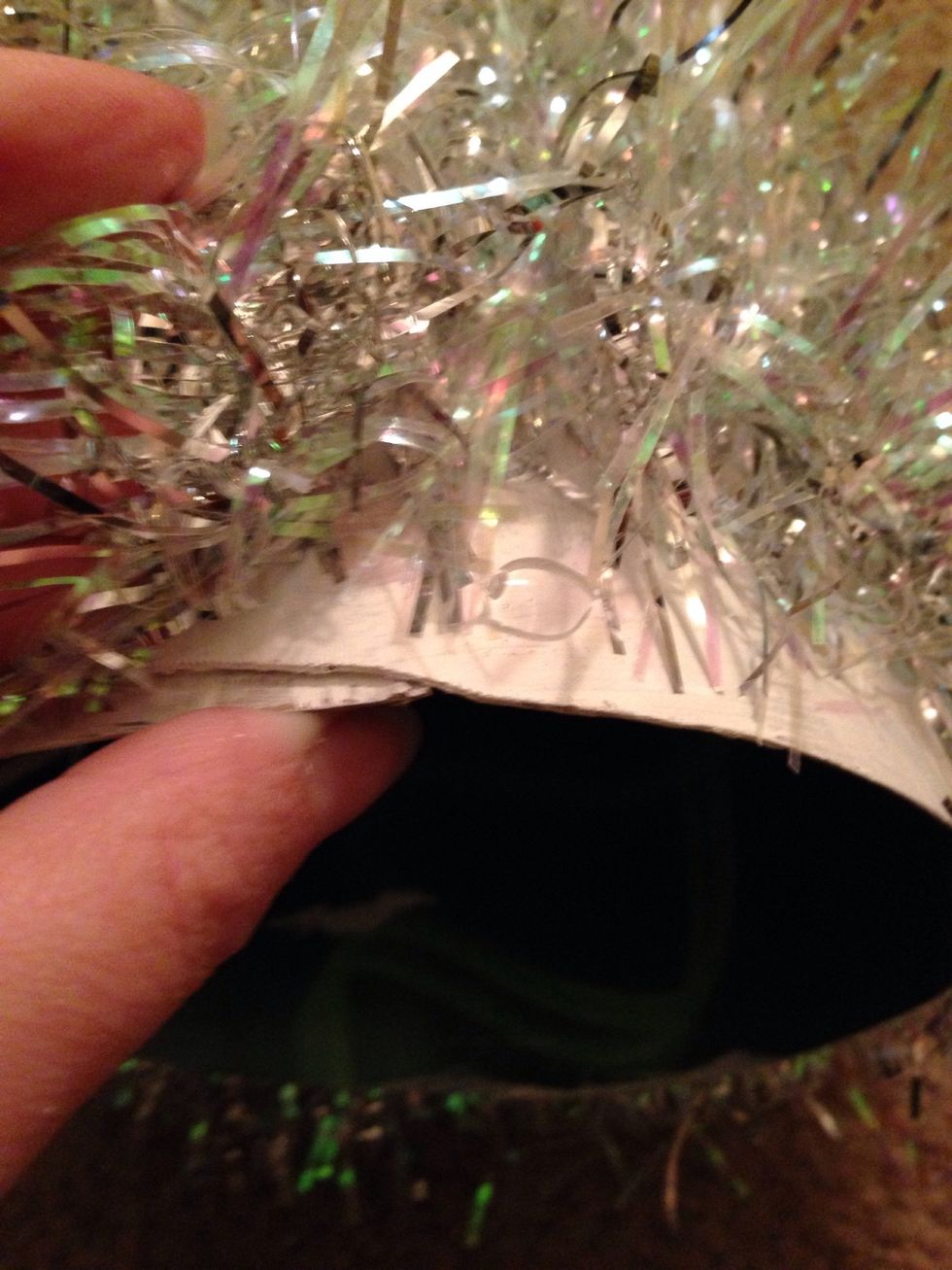 Wrap it all the way around and glue down the end at the bottom of the cone