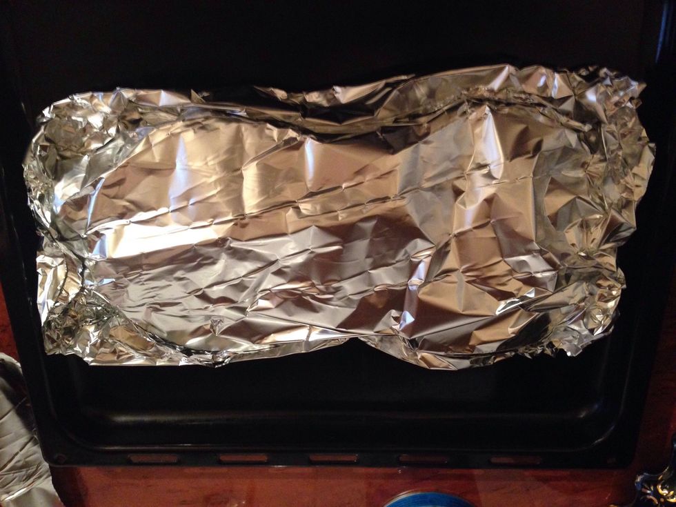 Wrap it and take to preheated oven (180C) for about 15 minutes. Then unwrap the top and leave to continue cooking for 10 more minutes, until the top is golden and crispy