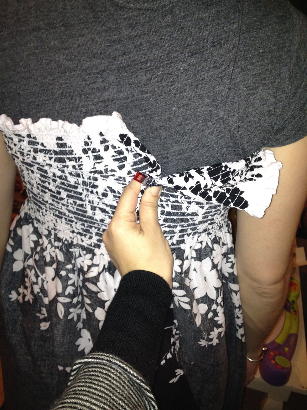 Wrap it around and stretch till it feels comfortable, either do this yourself and wrap to the front and pin, or have a friend help.