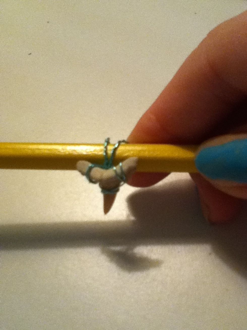 Wrap it around something like a pen or a pencil