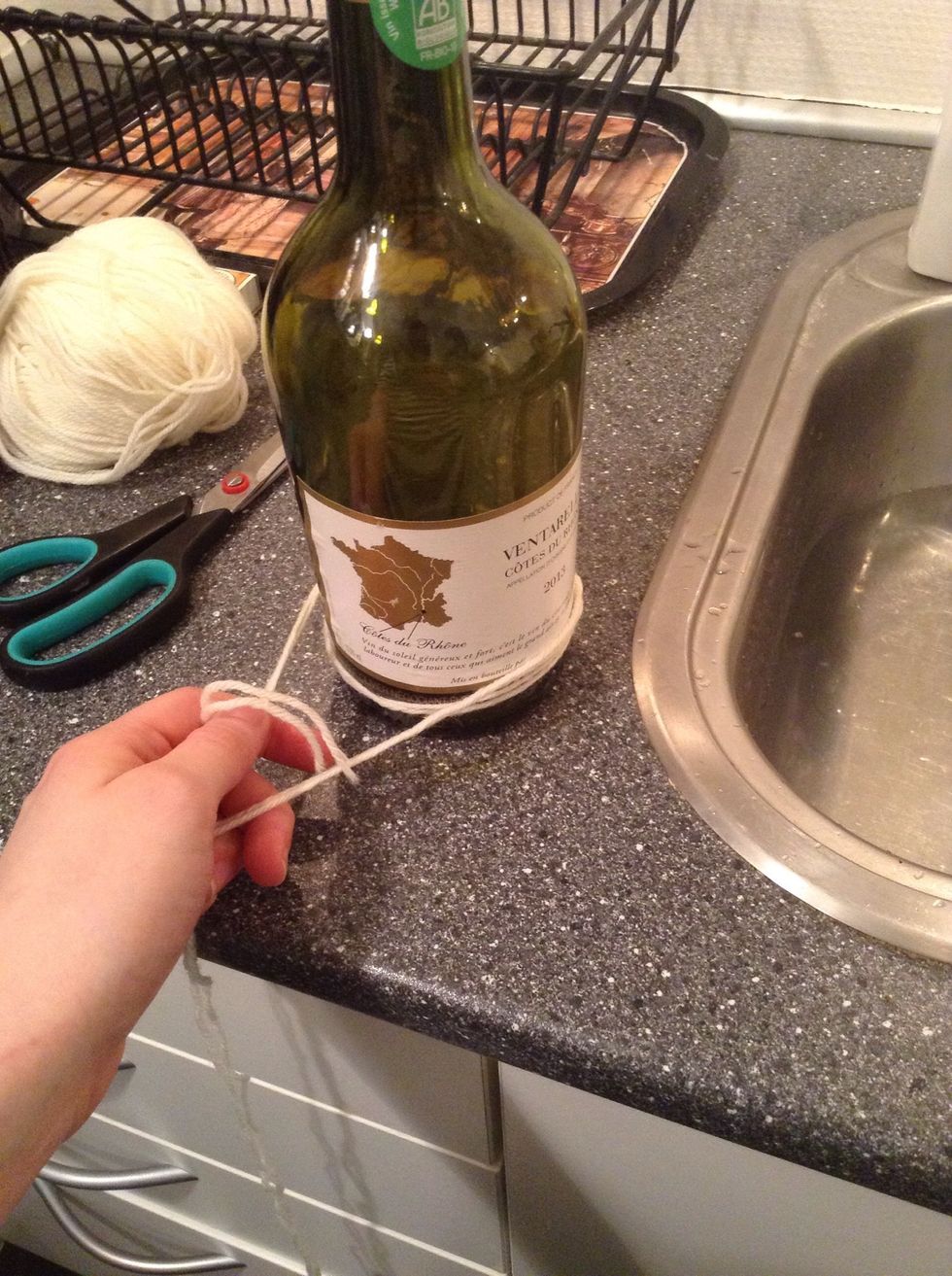 Wrap it around the lower end of the bottle