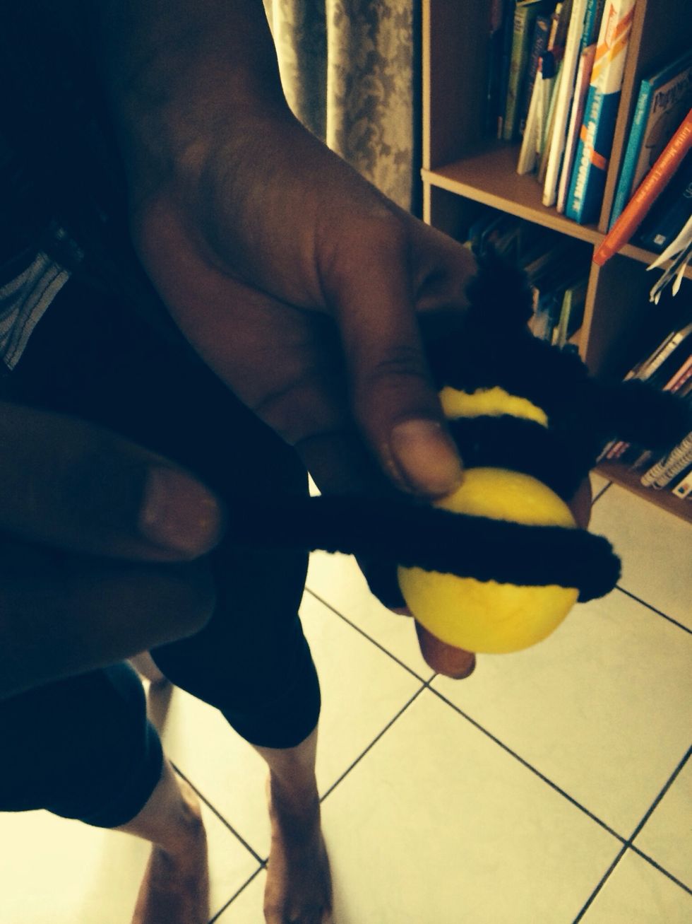 Wrap it around the middle of the ball.