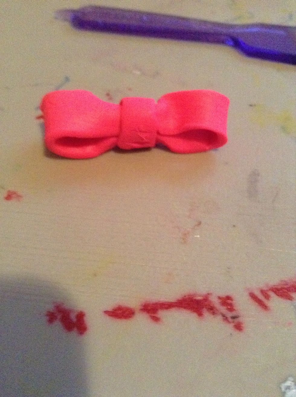 Wrap it on the pinched area... And you made an easy bow