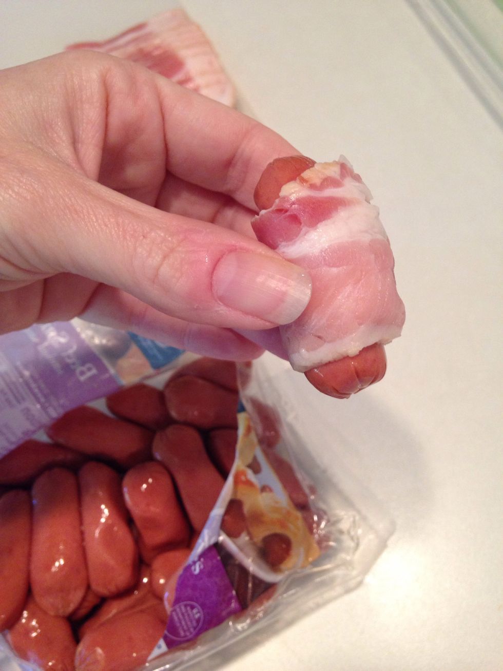 Wrap little smokies with small slice of bacon.