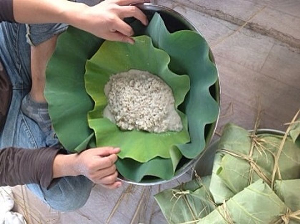 Wrap mixture with lotus leaf. And tie it with rice straw.