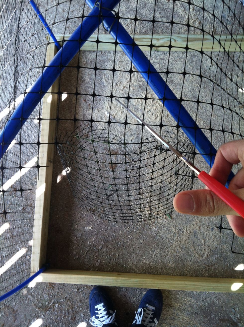 Wrap netting one direction, tie it to tubing with zip ties and staple to wood. Trim out the triangles that overlap as in photo.