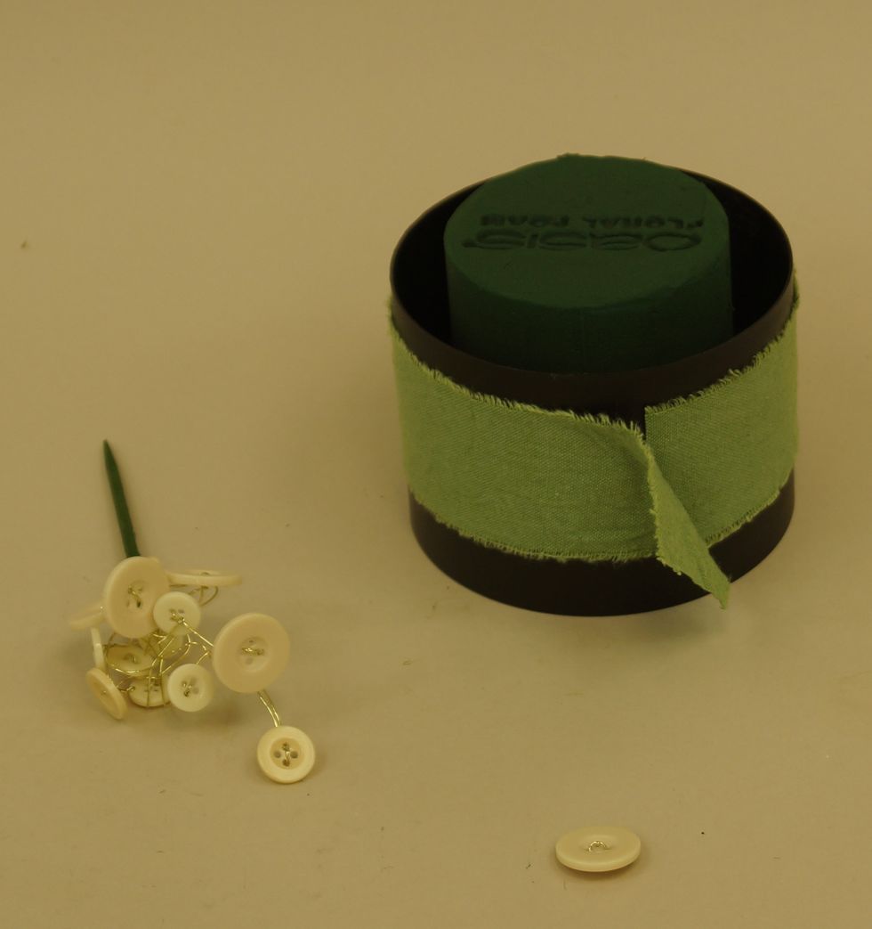 Wrap OASIS\u2122 Raw Muslin around OASIS\u00ae Table Deco Holder. Prepare decorative product by bunching onto wooden picks.