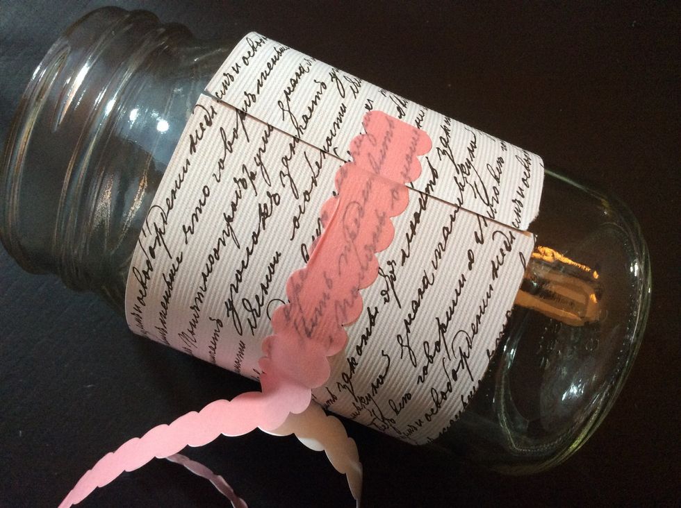 Wrap paper around jar and secure with washi tape.
