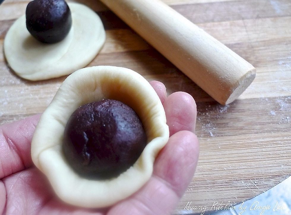 Wrap red bean paste with the dough.