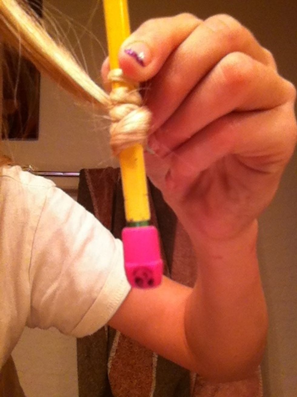 Wrap some hair around pencil