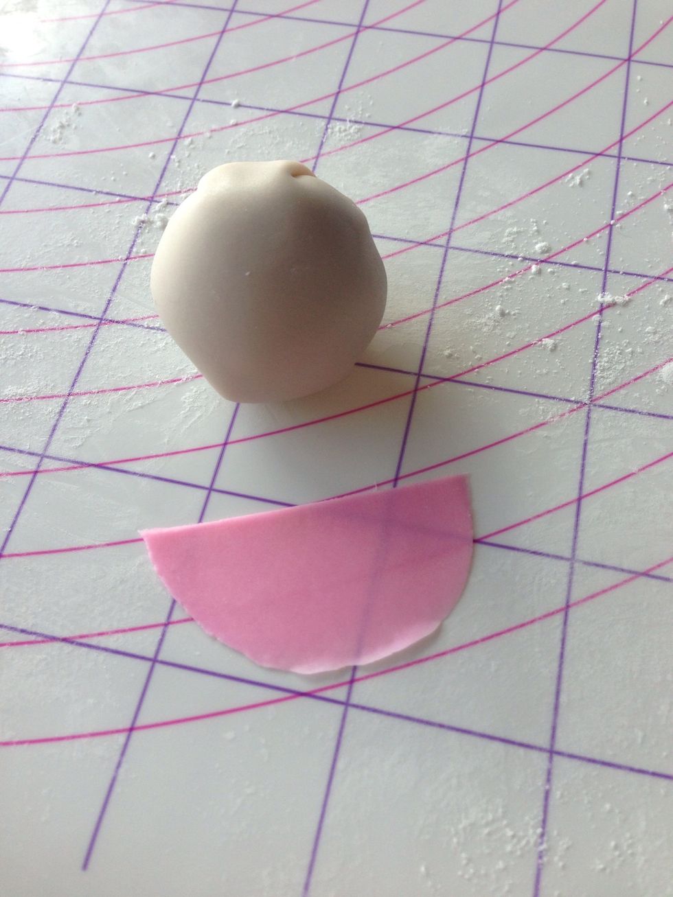 Wrap the ball to form lalaloopsie face. Prepare pink fondant for her hair