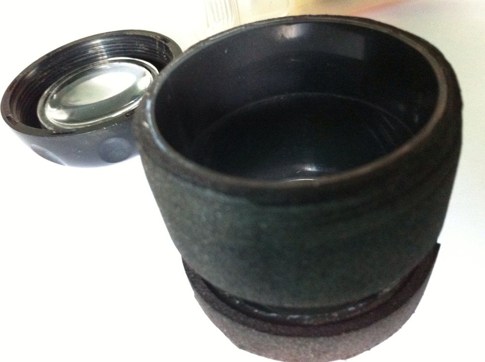 Wrap the cap of cuttonbud box with black spon, use super glue for making spon strongly patched