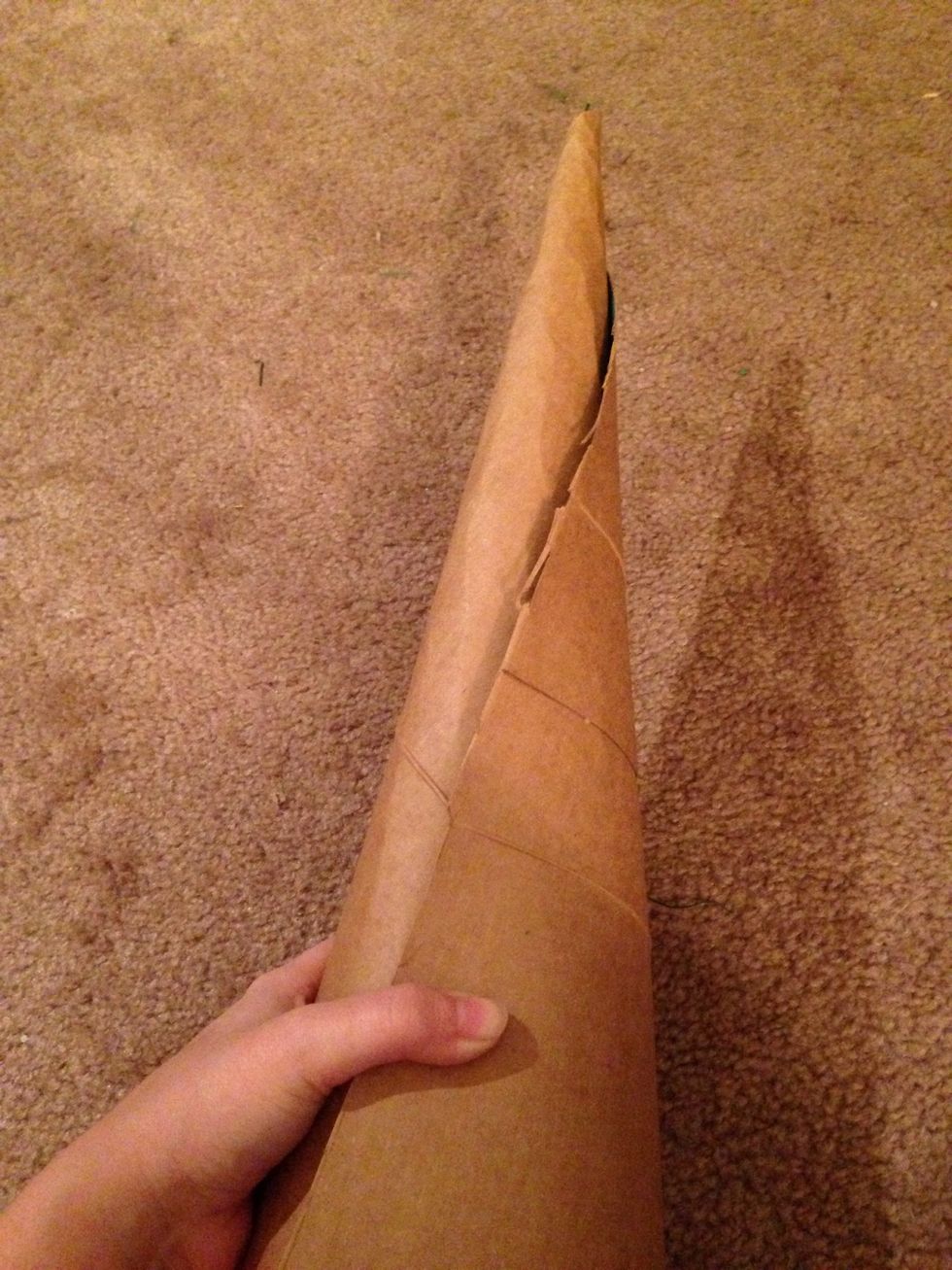 Wrap the cardboard around so you have the cone shape