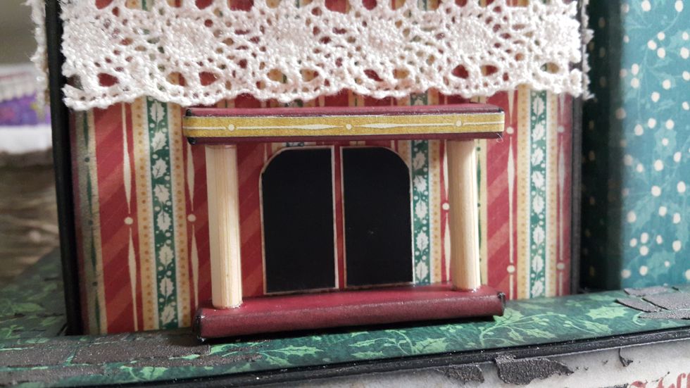 Wrap the chipboard with paper like a tiny gift, cut length of bamboo chopsticks, adhere all on the house using strong glue like Glossy Accents, you can add pattern paper strips for decorations