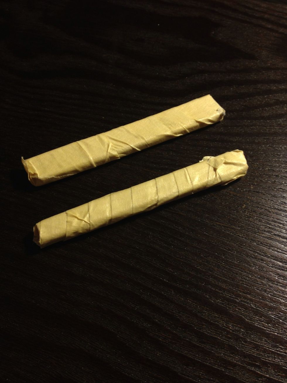 Wrap the chopsticks with the masking tape so it will provide a smooth surface against your finger.