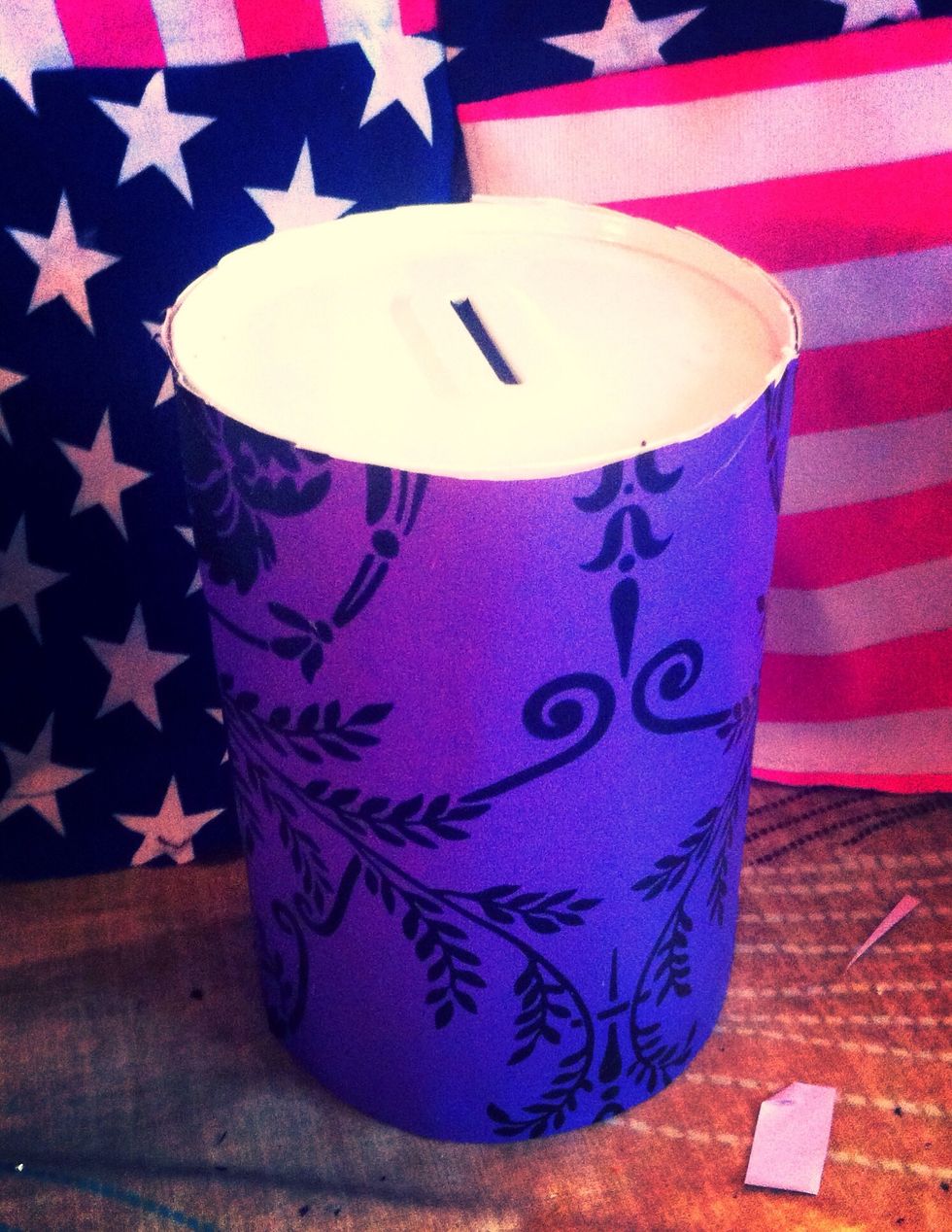 Wrap the desired paper around the tin, cut if paper is too long. I chose wallpaper because it's already decorated and makes it look more expensive