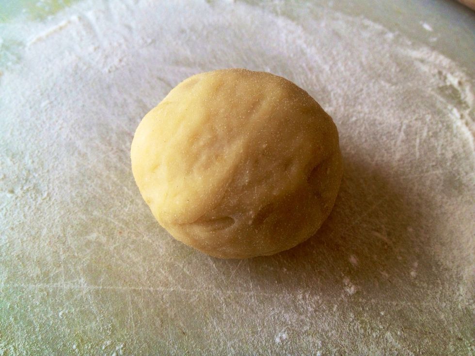 Wrap the dough around the filling. Roll the dough into a round ball without any openings to make sure the red bean does not come out while baking in the oven. Repeat for all the dough pieces.