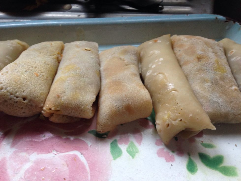 WRAP THE FILLING IN THE WRAPPERS: scoop a tablespoon of filling into a wrap. Fold as you desire, make sure to seal properly.