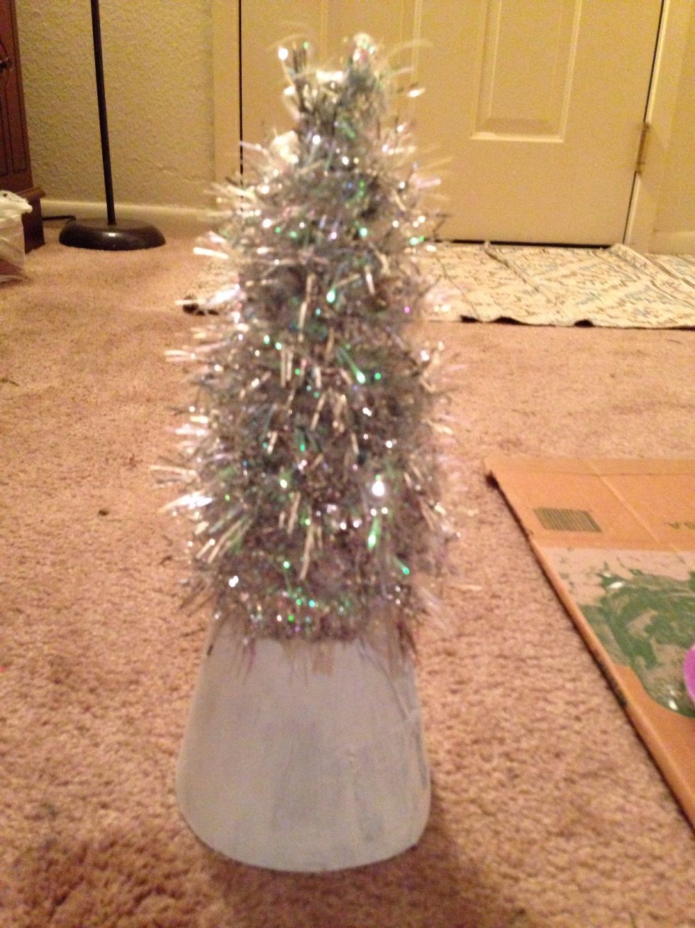 Wrap the first piece of garland around the cone and glue down the end
