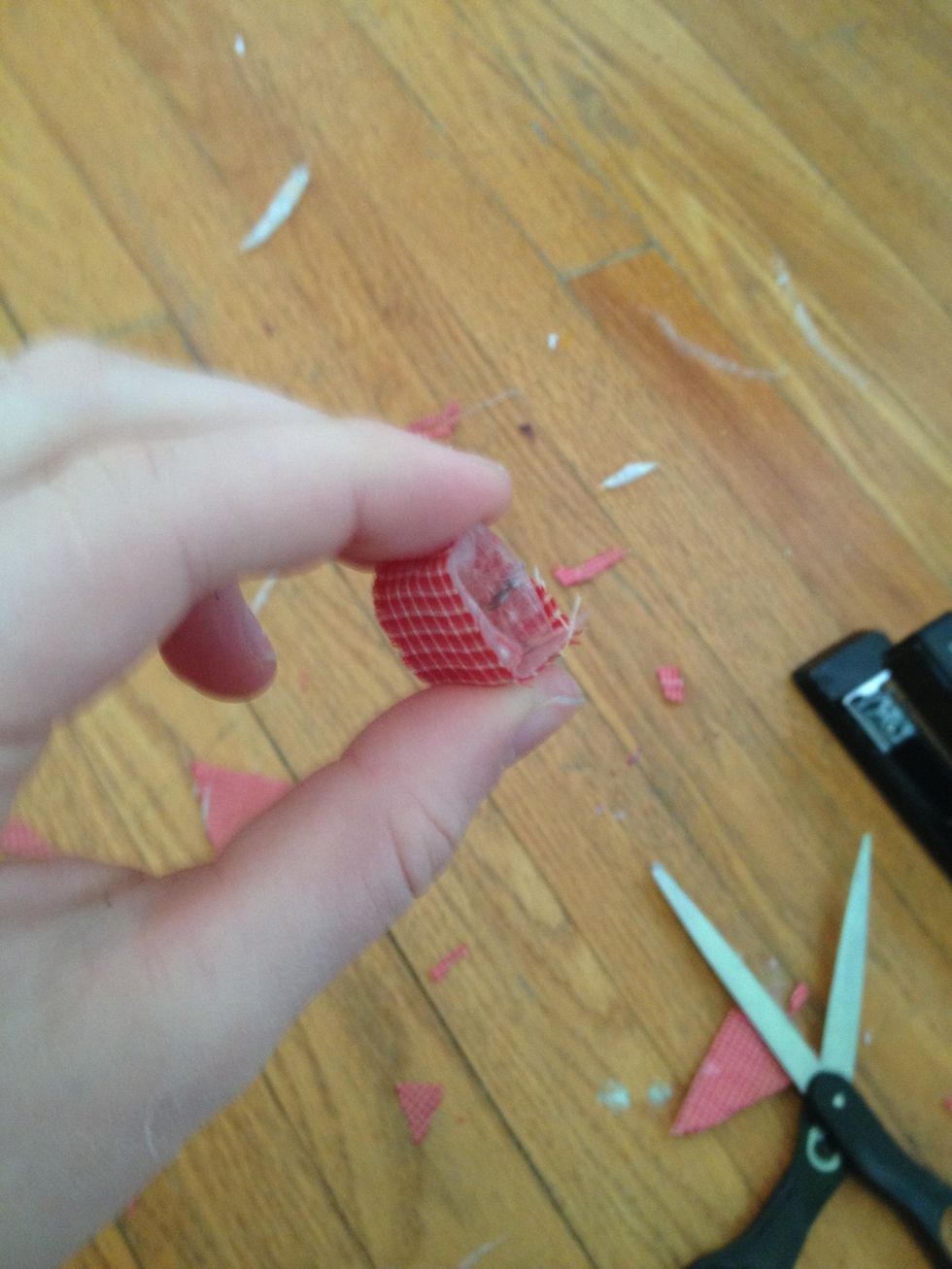 Wrap the first red shape around itself, leaving a hole in the middle.