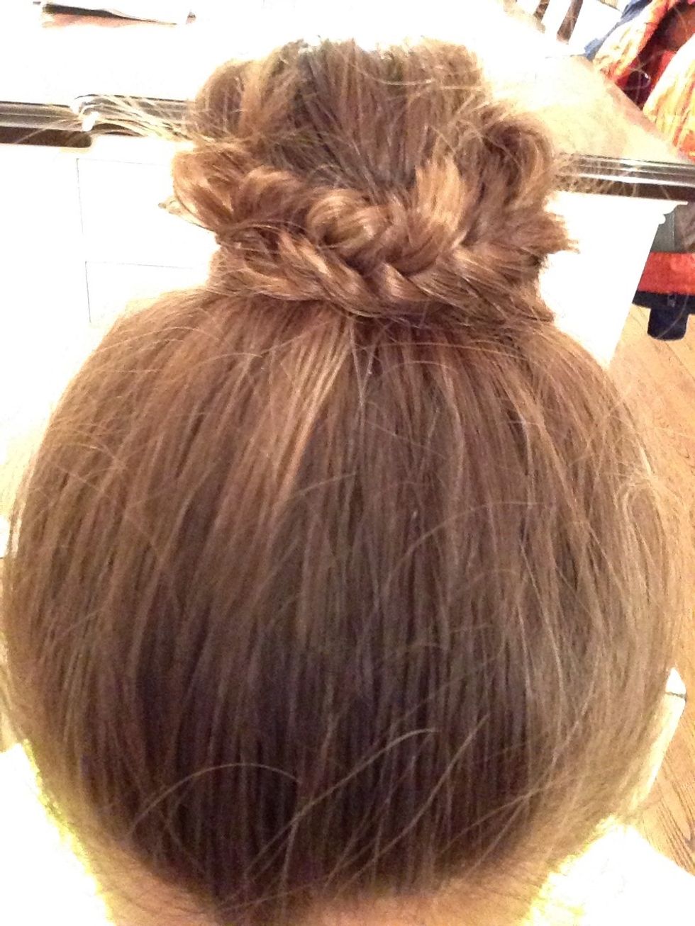 Wrap the fishtail around the bun and secure with a bobby pin