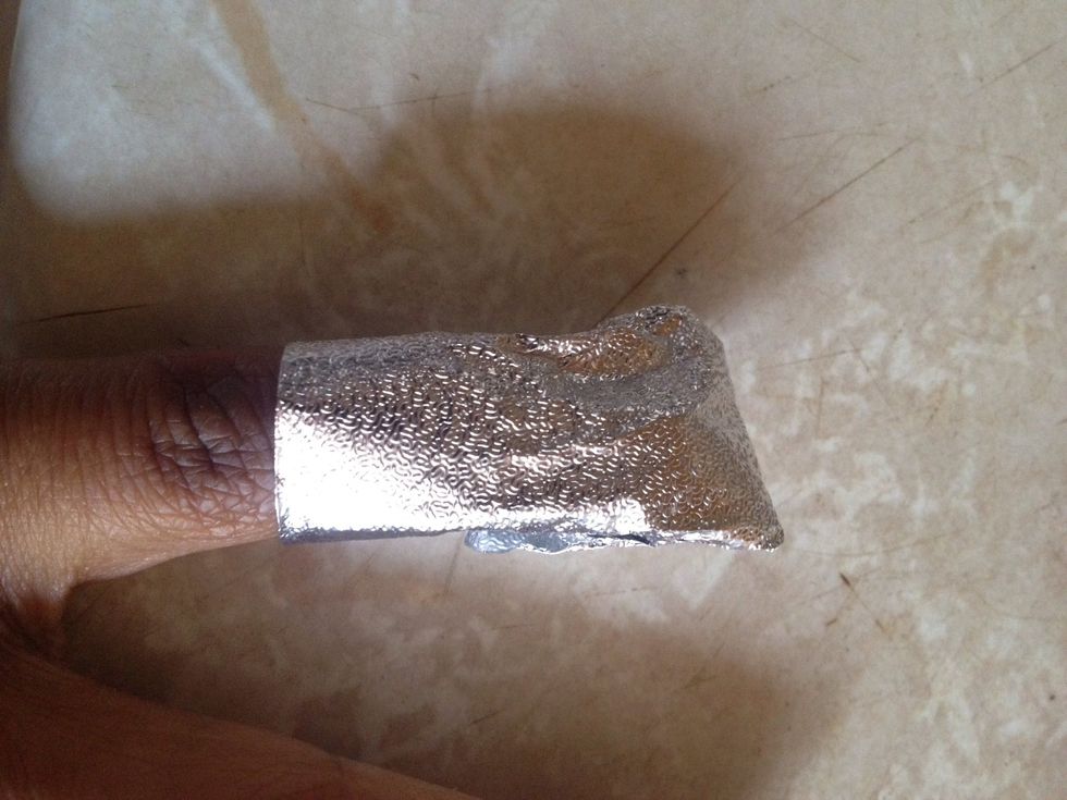 Wrap the foil securely around the nail. Let sit for at least 15 minutes.
