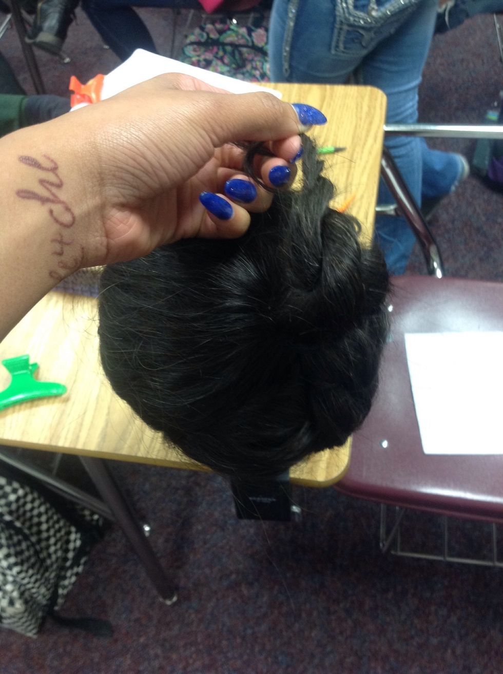 Wrap the hair into a loose bun