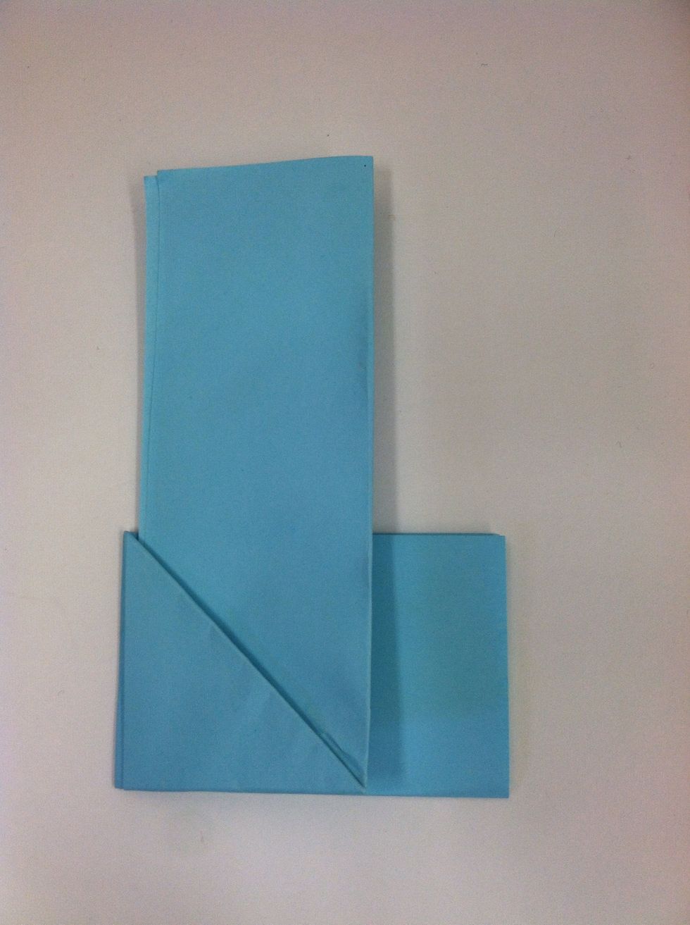 Wrap the horizontal leg of the backward "L" behind the vertical line until it come around the other side. There should still be a narrow rectangle hanging over the edge.
