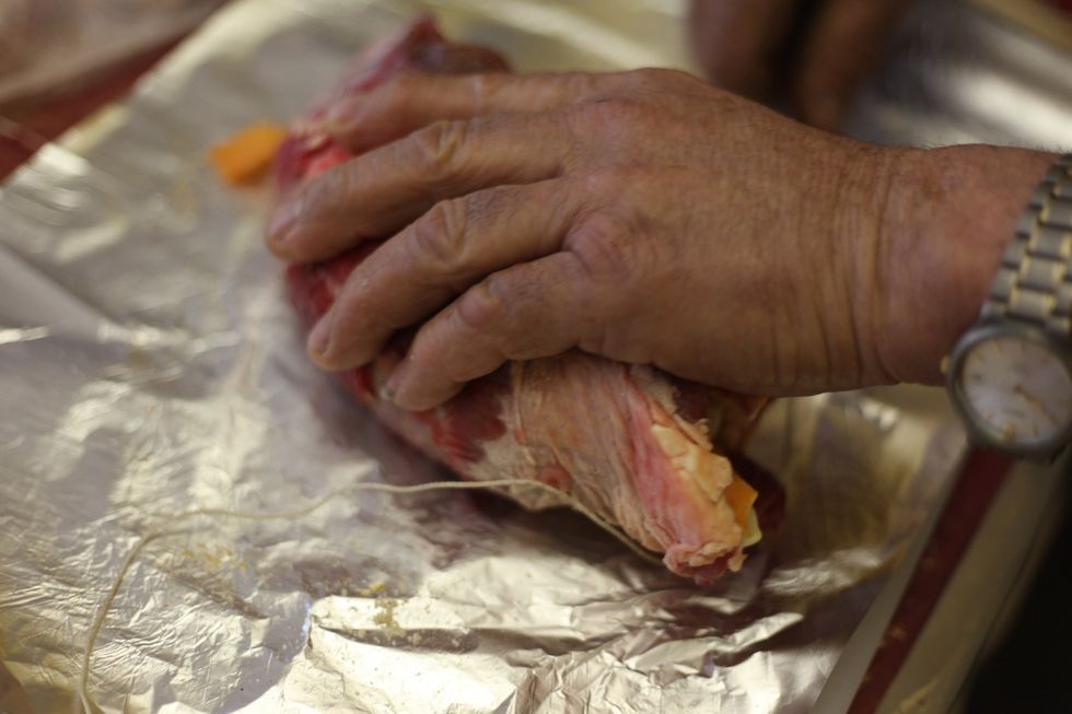 Wrap the ingredients around with the tenderized steak and use baking string to tie it up.