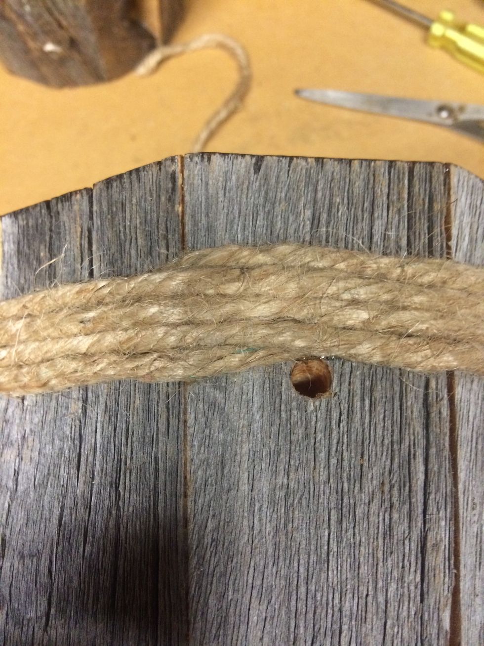 Wrap the jute around until desired amount. I'm putting 4 wraps on the top and 3 on the bottom. The last row is glued on every other joint. The ends are tucked in and a dab of glue to hold it in!