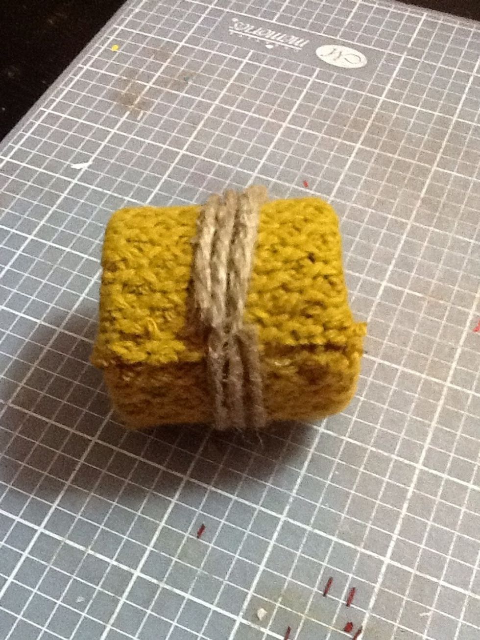 Wrap the jute three times around and hot glue the end down.