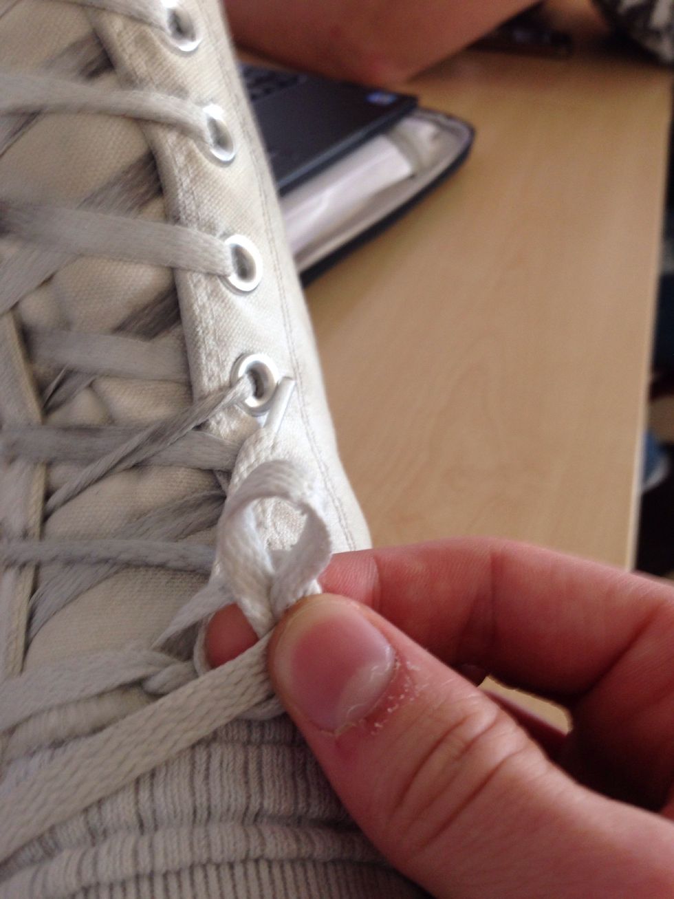 Wrap the left lace around the loop
