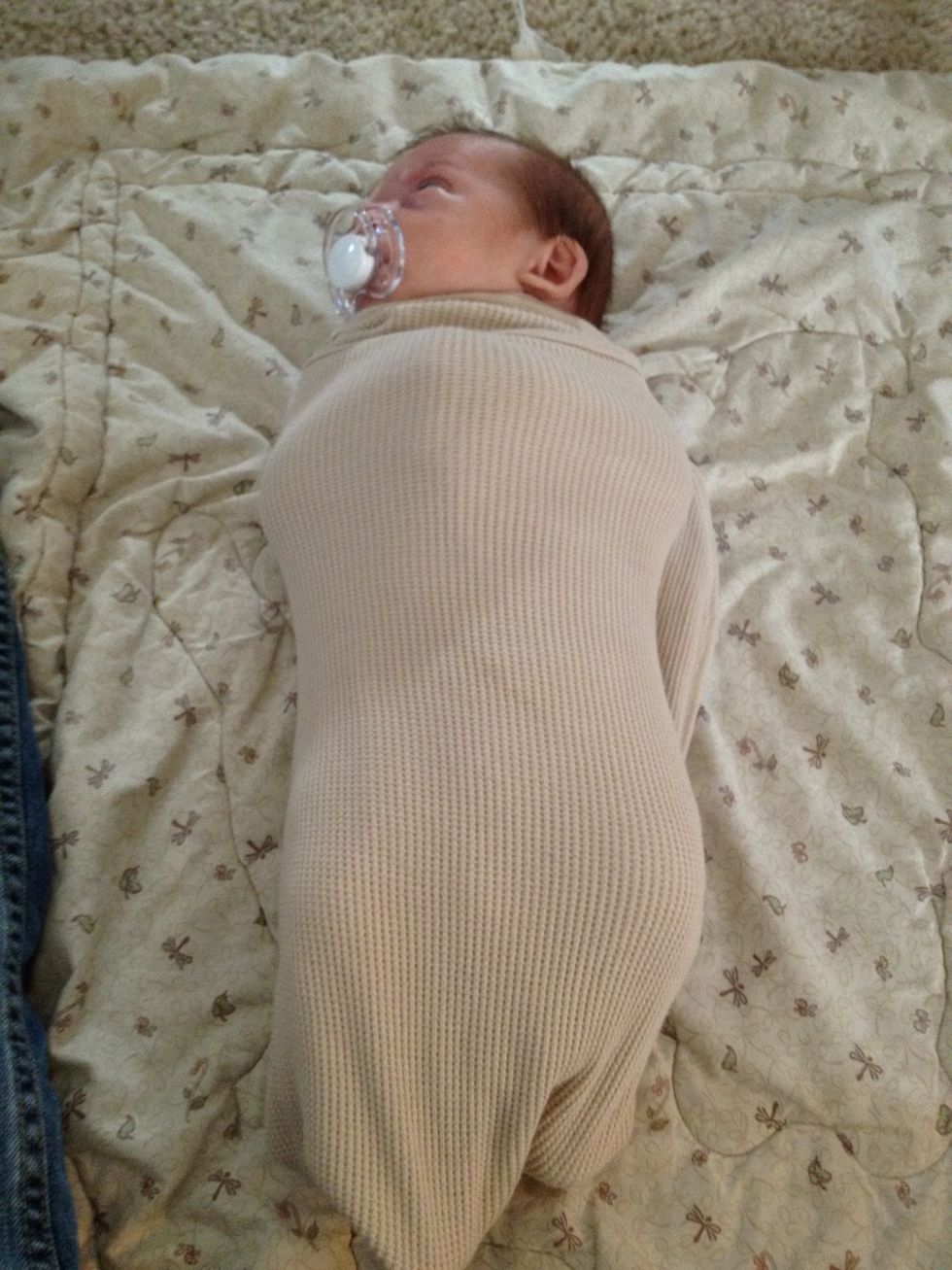 Wrap the left side around the baby and under.  Make sure you pull the blanket snug around the baby!!!