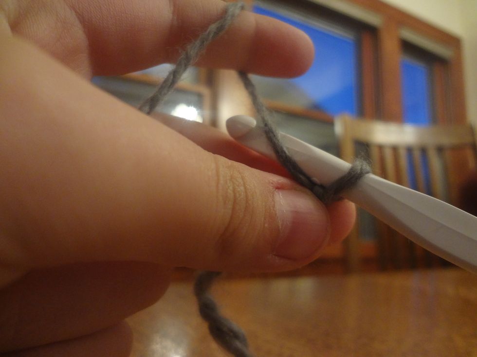 Wrap the long end of the yarn around...