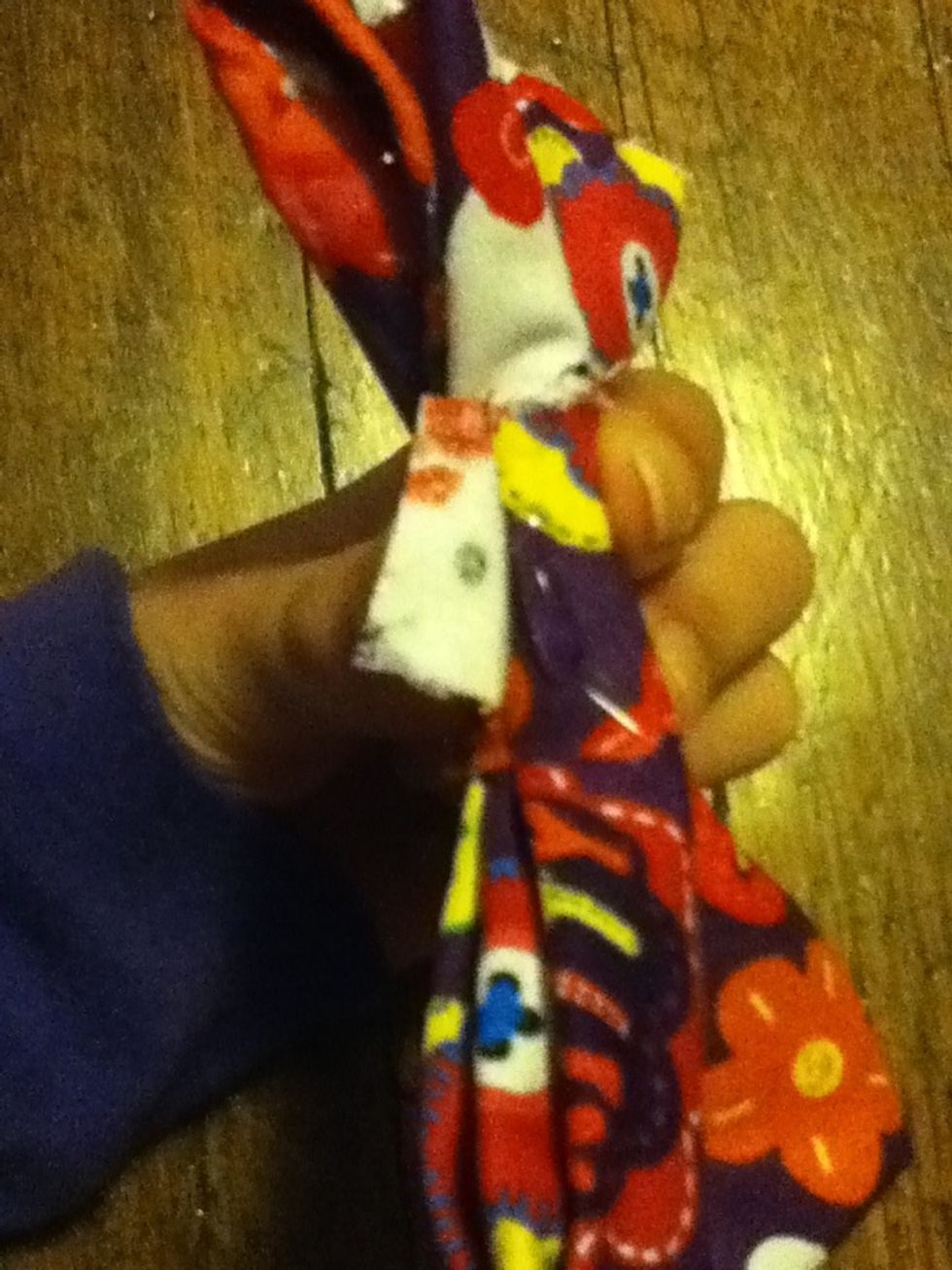 Wrap the long rectangle around the bow and when you get to the end, add a line of glue and press the fabric down and then add another line of glue on top of that